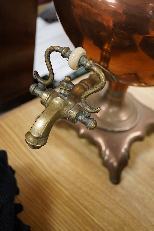An early 20th century copper tea urn, 45cm. Condition- fair to good